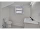 Light and bright bathroom with white fixtures and hexagon tile floor at 301 E Umstead St, Durham, NC 27707
