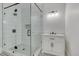 Modern bathroom featuring a glass enclosed shower with black fixtures and patterned tile floor at 301 E Umstead St, Durham, NC 27707