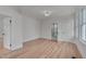 Bright bedroom with hardwood floors, large window, and ensuite bath at 301 E Umstead St, Durham, NC 27707