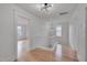 Hallway with hardwood floors, white trim and modern lighting at 301 E Umstead St, Durham, NC 27707