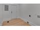 The laundry room features hardwood floors and white trim at 301 E Umstead St, Durham, NC 27707