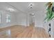 Open living room with hardwood floors, decorative lighting and white trim at 301 E Umstead St, Durham, NC 27707