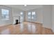 Spacious living room with hardwood floors, fireplace, and plenty of natural light at 301 E Umstead St, Durham, NC 27707