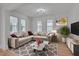 Cozy living room showcasing a plush sectional sofa, marble coffee table, and stylish decor at 301 E Umstead St, Durham, NC 27707