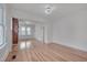 Bright living room showcasing hardwood floors, a brick fireplace and modern chandelier at 301 E Umstead St, Durham, NC 27707