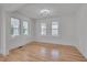 Inviting living room with ample natural light, hardwood floors, and neutral paint tones at 301 E Umstead St, Durham, NC 27707