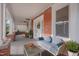 Spacious porch furnished with a comfortable couch and swing, creating a cozy outdoor living space at 301 E Umstead St, Durham, NC 27707
