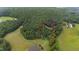 A private wooded lot with scenic views and a home tucked into the trees surrounded by mature forest at 301 Stone Currie Dr, Hillsborough, NC 27278