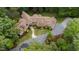 Aerial view showcasing the grand estate with circular driveway and lush landscaping at 301 Stone Currie Dr, Hillsborough, NC 27278