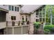 The backyard features a elevated wood deck with railings and is surrounded by lush trees and green grass at 301 Stone Currie Dr, Hillsborough, NC 27278