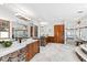 Luxurious bathroom features stone accents, double vanity, and glass walk-in shower at 301 Stone Currie Dr, Hillsborough, NC 27278