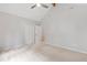 Spacious bedroom with neutral carpet, trim, and walls, as well as a ceiling fan and double closet at 301 Stone Currie Dr, Hillsborough, NC 27278