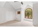 Bedroom featuring carpet, arched window, and closet at 301 Stone Currie Dr, Hillsborough, NC 27278