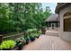 Spacious deck with elegant flower pots adding charm to this outdoor space with nature view at 301 Stone Currie Dr, Hillsborough, NC 27278