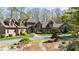 Impressive home featuring manicured landscaping, stone accents, and a welcoming entrance, all set in a mature treed lot at 301 Stone Currie Dr, Hillsborough, NC 27278
