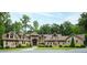 Well maintained single-story home with stone archway entry and manicured lawn surrounded by mature trees at 301 Stone Currie Dr, Hillsborough, NC 27278
