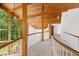 Hallway with high ceilings, natural light, wooden beams, and railing at 301 Stone Currie Dr, Hillsborough, NC 27278