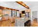 Kitchen with granite countertops, stainless appliances, a double island, and built-in microwave and oven at 301 Stone Currie Dr, Hillsborough, NC 27278