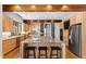 Gourmet kitchen with granite countertops, stainless steel appliances, kitchen island, and ample cabinet space at 301 Stone Currie Dr, Hillsborough, NC 27278