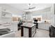 Convenient laundry room with white cabinets, granite countertops, sink, and plenty of counter space at 301 Stone Currie Dr, Hillsborough, NC 27278