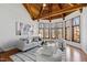 Inviting living room with vaulted wood ceiling, and walls of bright windows at 301 Stone Currie Dr, Hillsborough, NC 27278