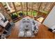 Open living room features a soaring wall of windows, fireplace, and comfortable modern furniture at 301 Stone Currie Dr, Hillsborough, NC 27278