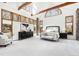 Spacious main bedroom features wood beam accents, stone wall, and ample natural light at 301 Stone Currie Dr, Hillsborough, NC 27278