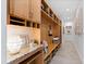 Well-organized mudroom with custom cabinets, countertop, bench and ample storage space at 301 Stone Currie Dr, Hillsborough, NC 27278