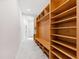 Bright mudroom with tile floors, wooden shelving, built-in bench and storage at 301 Stone Currie Dr, Hillsborough, NC 27278