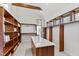 Bright walk-in closet offers custom shelves, drawers, and a center storage island at 301 Stone Currie Dr, Hillsborough, NC 27278