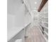 Long walk-in closet with multiple shelves and racks for optimal storage and organization at 301 Stone Currie Dr, Hillsborough, NC 27278