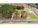 Aerial view of the property, displaying the home's setting among lush greenery and trees at 3026 Shoeheel Rd, Kenly, NC 27542