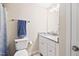 Bathroom with granite countertop, white cabinetry, and shower with patterned curtain at 3026 Shoeheel Rd, Kenly, NC 27542