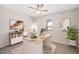 Bright bedroom space with neutral colors, desk, and shelving at 3026 Shoeheel Rd, Kenly, NC 27542