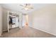 Bedroom featuring a ceiling fan, closet, and neutral carpet at 3026 Shoeheel Rd, Kenly, NC 27542