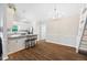 Open kitchen with granite countertop, stainless appliances, and breakfast bar seating at 3026 Shoeheel Rd, Kenly, NC 27542