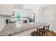 Spacious kitchen featuring granite countertops, stainless appliances, and modern cabinetry at 3026 Shoeheel Rd, Kenly, NC 27542