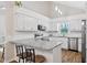Open kitchen featuring stainless steel appliances, granite countertops, and breakfast bar at 3026 Shoeheel Rd, Kenly, NC 27542