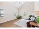 Bright living room featuring vaulted ceilings, hardwood floors, and lots of natural light at 3026 Shoeheel Rd, Kenly, NC 27542