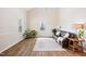 Inviting living room boasting natural light, hardwood floors and a cozy seating area at 3026 Shoeheel Rd, Kenly, NC 27542