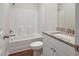 Bathroom with a tub/shower combination, granite countertop, and white cabinets at 303 Azalea Gaze Dr, Youngsville, NC 27596