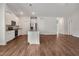 Spacious, bright kitchen featuring white cabinets, stainless steel appliances, and a large island, perfect for entertaining at 303 Azalea Gaze Dr, Youngsville, NC 27596