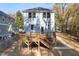 Backyard view featuring a wooden deck and a neatly landscaped yard, perfect for outdoor enjoyment at 306 Cecil St, Durham, NC 27707