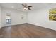Bedroom with wood floors, ceiling fan, and exterior doors at 306 Cecil St, Durham, NC 27707