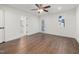 Large bedroom features ceiling fan, two windows, and access to bathroom at 306 Cecil St, Durham, NC 27707