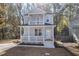 Charming two-story home with a welcoming front porch and white railings at 306 Cecil St, Durham, NC 27707