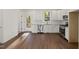 A kitchen featuring stainless appliances, white cabinets and a sliding door to a deck at 306 Cecil St, Durham, NC 27707