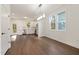 Eat-in kitchen features white cabinets, stainless steel appliances, and bright light at 306 Cecil St, Durham, NC 27707