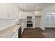 Bright kitchen with stainless appliances, granite countertops and subway tile backsplash at 306 Cecil St, Durham, NC 27707
