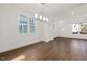Bright living room boasts hardwood floors, ample natural light, and neutral paint at 306 Cecil St, Durham, NC 27707